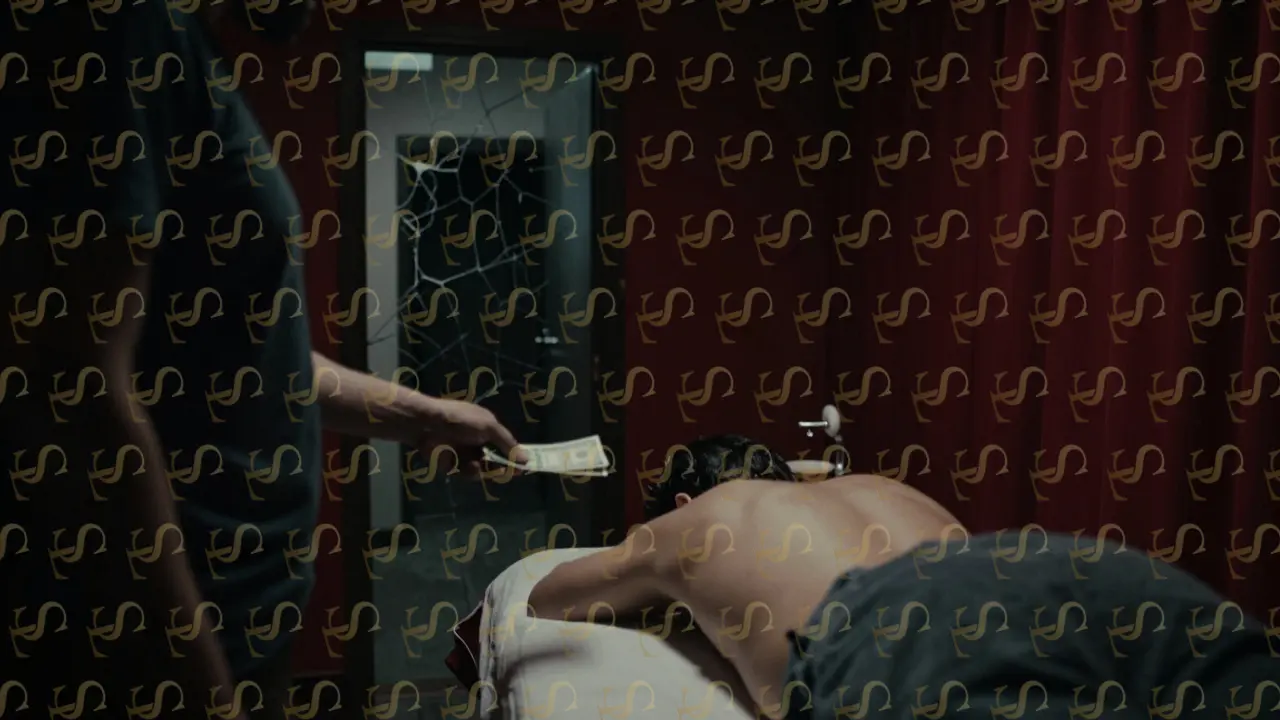Dimly lit illegal massage room with cash exchange and client partially undressed, conveying secrecy and risk.